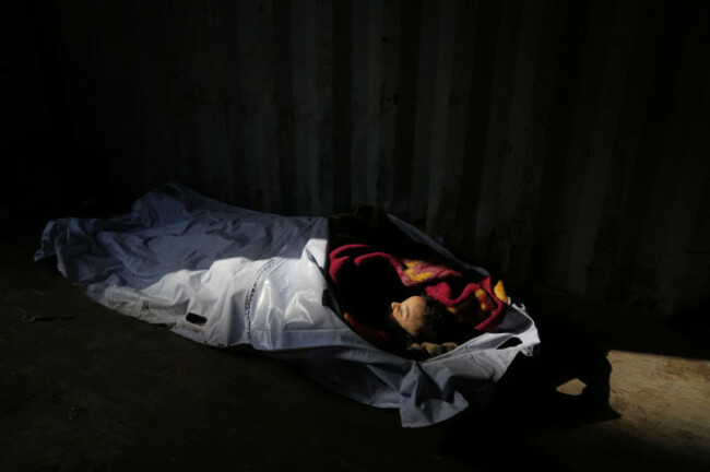 the-body-of-4-year-old-palestinian-ahmed-weshah-lies-next-to-that-of-his-mother-afaf-abu-jahjouh-28-who-were-both-killed-in-an-israeli-military-strike-on-sunday-before-their-funeral-at-awda-hospi