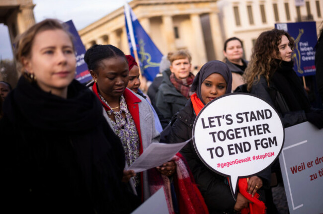 women-attend-a-protest-of-the-terre-des-femmes-human-rights-organisation-to-mark-the-international-day-for-the-elimination-of-violence-against-women-in-front-of-the-brandenburg-gate-in-berlin-germany