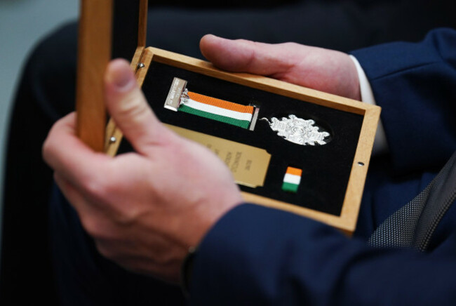 a-scott-medal-is-held-during-a-ceremony-to-award-deceased-retired-and-serving-members-of-an-garda-siochana-with-bravery-medals-at-walter-scott-house-military-road-dublin-picture-date-friday-may-2