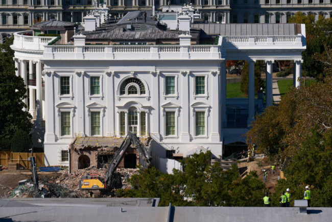 construction-workers-atop-the-u-s-treasury-bottom-right-watch-as-work-continues-on-a-largely-demolished-part-of-the-east-wing-of-the-white-house-thursday-oct-23-2025-in-washington-before-cons