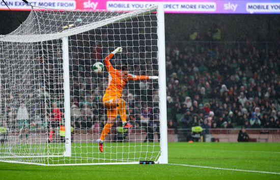 the-ball-hits-off-nicky-evrard-for-katie-mccabe-to-score-her-second-goal