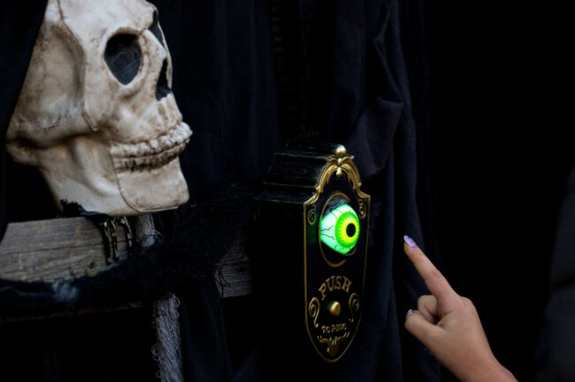 a-girl-rings-the-doorbell-of-a-horror-themed-room-at-the-west-side-hallo-fest-the-countrys-largest-halloween-festival-in-bucharest-romania-friday-oct-24-2025-ap-photoandreea-alexandru