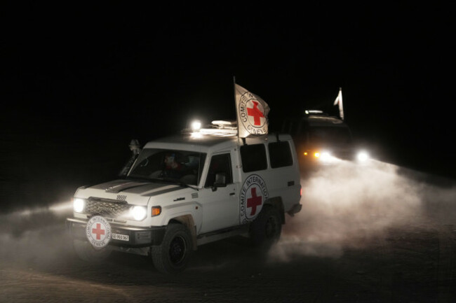 red-cross-vehicles-carrying-the-bodies-of-three-people-believed-to-be-deceased-hostages-handed-over-by-hamas-make-their-way-toward-the-border-crossing-with-israel-to-be-transferred-to-israeli-authori