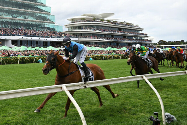 melbourne-australia-04th-nov-2025-jockey-jamie-melham-left-rides-half-yours-back-to-the-enclosure-following-victory-in-the-2025-melbourne-cup-for-trainers-tony-and-calvin-mcevoy-at-flemington-ra