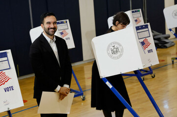 new-york-united-states-04th-nov-2025-new-york-democratic-mayoral-candidate-zohran-mamdani-left-waits-for-his-wife-rama-duwaji-to-finish-voting-on-election-day-at-the-frank-sinatra-school-of-arts