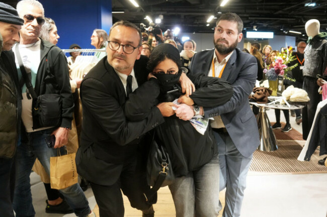 a-protester-is-being-evacuated-from-the-bhv-department-store-as-fast-fashion-shein-opens-its-first-physical-store-wednesday-nov-5-2025-in-paris-ap-photothibault-camus