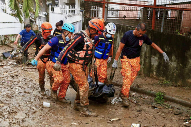 rescue-workers-walk-carrying-a-body-bag-after-flooding-caused-by-typhoon-kalmaegi-in-cebu-city-central-philippines-tuesday-nov-4-2025-ap-photojacqueline-hernandez