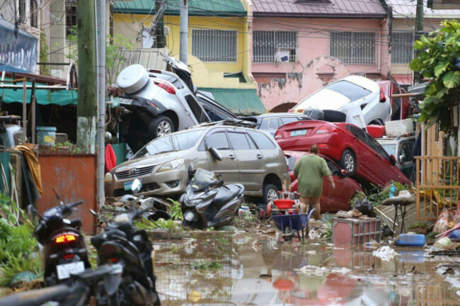 vehicles-lie-piled-on-after-flooding-caused-by-typhoon-kalmaegi-in-cebu-city-central-philippines-tuesday-nov-4-2025-ap-photojacqueline-hernandez