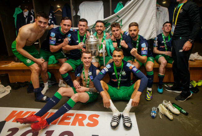 rovers-celebrate-with-the-trophy-in-the-dressing-room