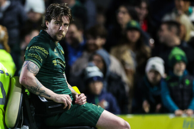 mack-hansen-leaves-the-field-with-an-injury