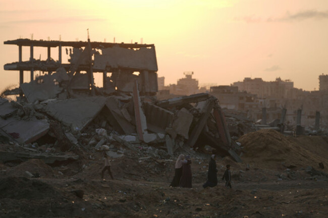 palestinians-walk-through-the-destruction-caused-by-the-israeli-air-and-ground-offensive-in-sheikh-radwan-neighborhood-in-gaza-city-tuesday-nov-11-2025-ap-photojehad-alshrafi