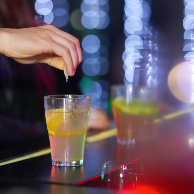 always-keep-you-eyes-on-your-drink-closeup-shot-of-a-man-drungs-into-a-drink-in-a-nightclub