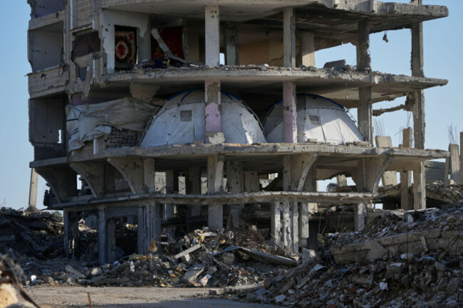 tents-are-set-up-inside-a-gutted-apartment-building-in-khan-younis-in-the-southern-gaza-strip-saturday-nov-15-2025-ap-photoabdel-kareem-hana