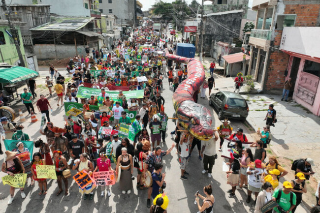 activists-march-at-a-climate-protest-during-the-cop30-u-n-climate-summit-monday-nov-17-2025-in-belem-brazil-ap-photoandre-penner
