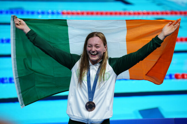 irelands-mona-mcsharry-celebrates-winning-bronze-during-the-womens-100m-breaststroke-final-at-the-paris-la-defense-arena-on-the-third-day-of-the-2024-paris-olympic-games-in-france-picture-date-mon
