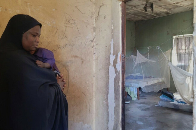 file-amina-hassan-wife-of-the-vice-principal-of-the-government-girls-comprehensive-secondary-school-where-gunmen-attacked-the-school-dormitory-abducted-schoolgirls-and-killed-her-husband-stands