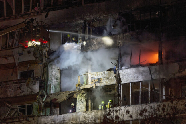 firefighters-put-out-the-fire-after-a-drone-hit-a-multi-storey-residential-building-during-russias-night-drone-attack-in-kyiv-ukraine-tuesday-nov-25-2025-ap-photoefrem-lukatsky