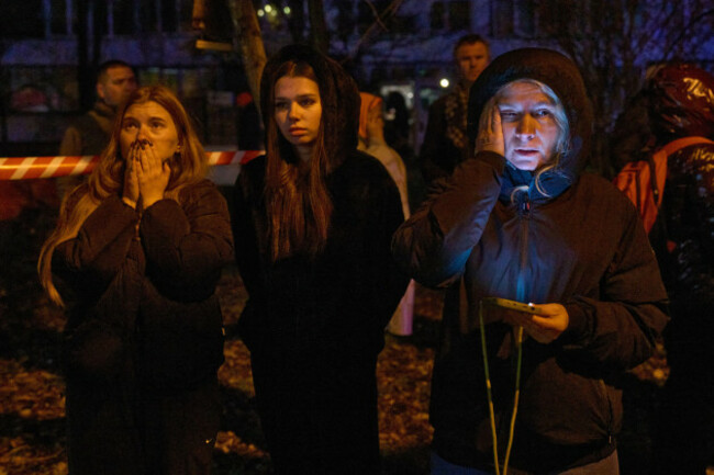 local-residents-react-as-they-watch-their-burning-home-after-a-drone-hit-a-multi-storey-residential-building-during-russias-night-drone-attack-in-kyiv-ukraine-tuesday-nov-25-2025-ap-photoefre