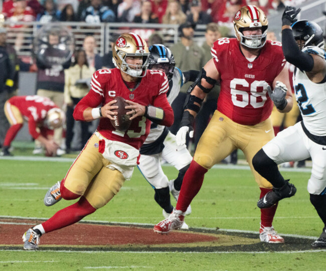 santa-clara-united-states-24th-nov-2025-san-francisco-49ers-quarterback-brock-purdy-13rolls-out-to-pass-against-the-carolina-panthers-in-the-second-quarter-at-levis-stadium-in-santa-clara-cali