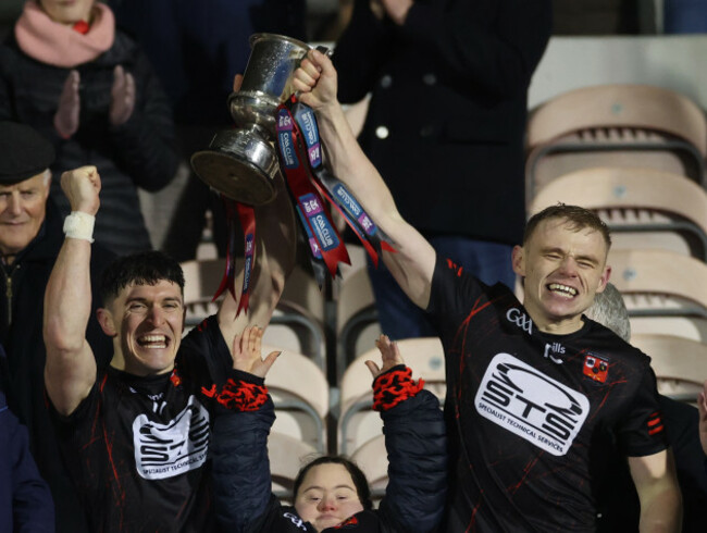 peter-hogan-and-michael-mahony-lift-the-trophy