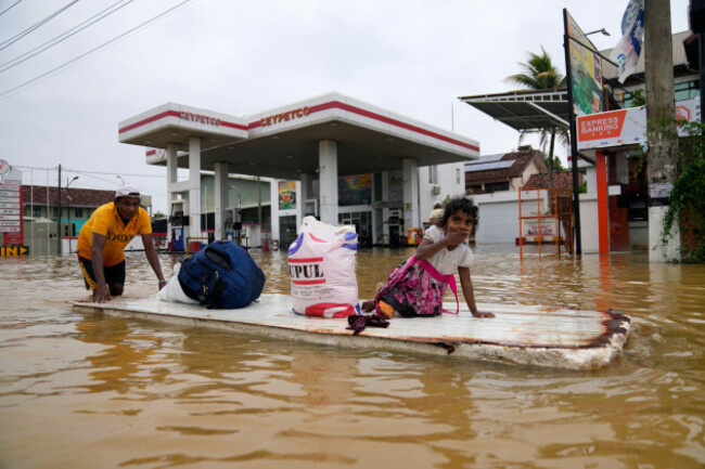 a-man-uses-a-makeshift-raft-to-navigate-a-flooded-street-in-colombo-sri-lanka-saturday-nov-29-2025-ap-photoeranga-jayawardena