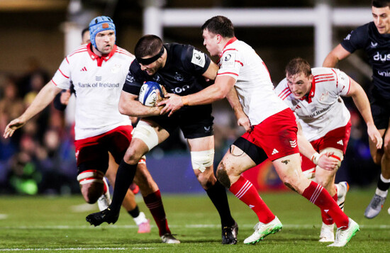 josh-bayliss-is-tackled-by-tadhg-beirne-shane-daly-and-gavin-coombes