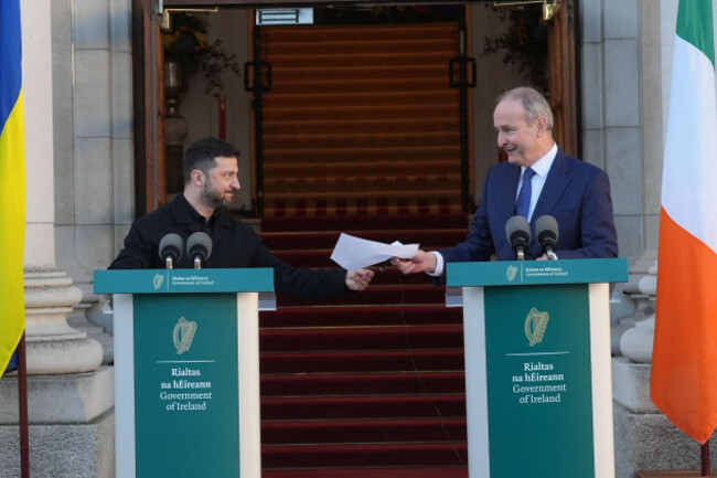 ukrainian-president-volodymyr-zelensky-collects-taoiseach-micheal-martins-notes-which-were-blown-by-the-wind-during-a-press-conference-at-the-government-buildings-in-dublin-during-his-visit-to-irela