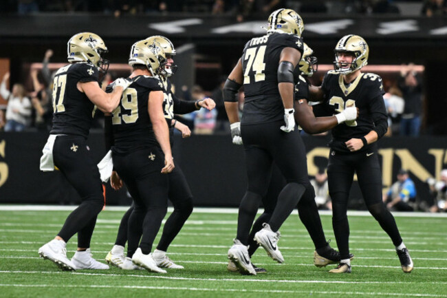 new-orleans-saints-place-kicker-charlie-smyth-39-and-teammates-celebrate-after-field-goal-in-the-second-half-of-an-nfl-football-game-against-the-carolina-panthers-sunday-dec-14-2025-in-new-orle