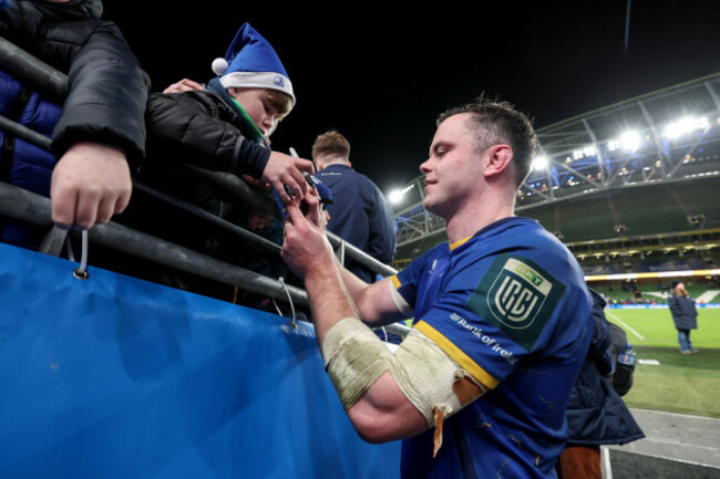 james-ryan-signs-an-autograph-for-a-young-fan-after-the-game