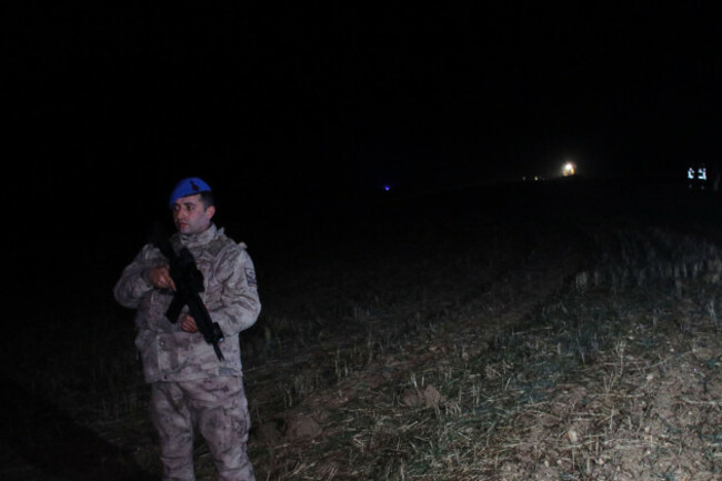 a-turkish-army-officer-stands-guard-as-rescue-teams-search-for-the-remains-of-a-private-jet-carrying-libyas-military-chief-and-four-others-that-crashed-after-taking-off-from-ankara-killing-everyone