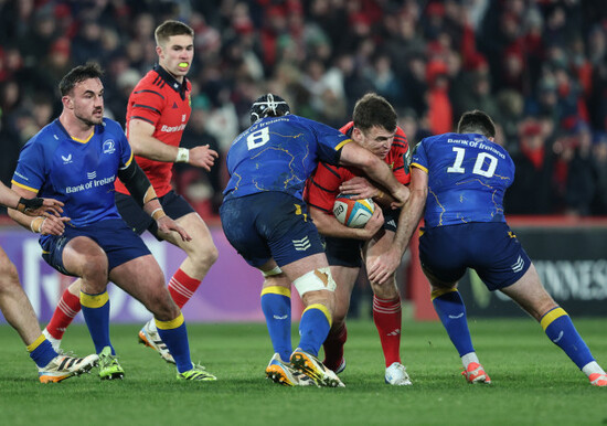 tom-farrell-is-tackled-by-caelan-doris-and-harry-byrne