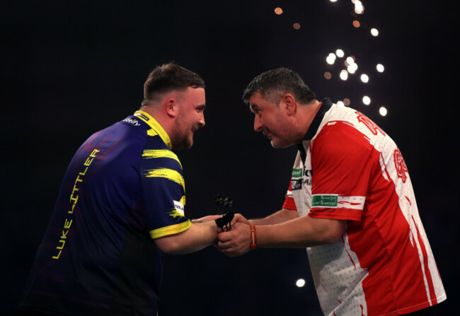 englands-luke-littler-left-celebrates-defeating-austrias-mensur-suljovic-on-day-fourteen-of-the-paddy-power-world-darts-championship-at-the-alexandra-palace-london-picture-date-saturday-decembe