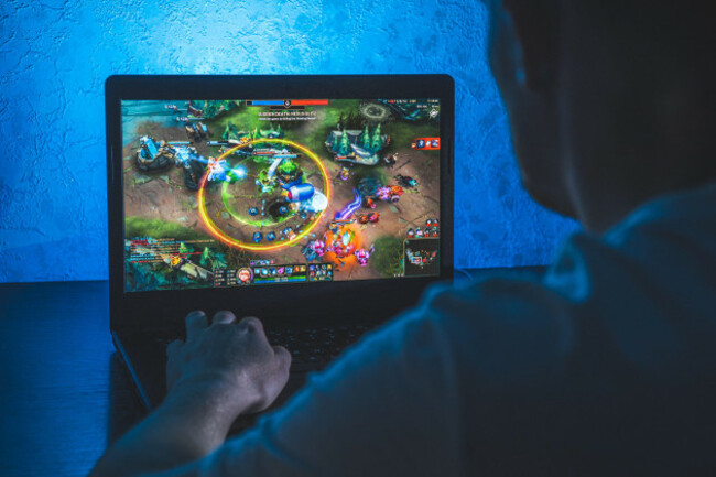 person-playing-league-of-legends-video-game-on-computer