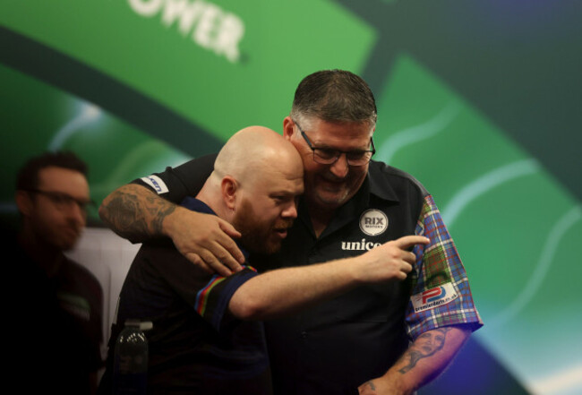 gary-anderson-and-justin-hood-embrace-each-other-after-their-match-on-day-eighteen-of-the-paddy-power-world-darts-championship-at-the-alexandra-palace-london-picture-date-thursday-january-1-2026