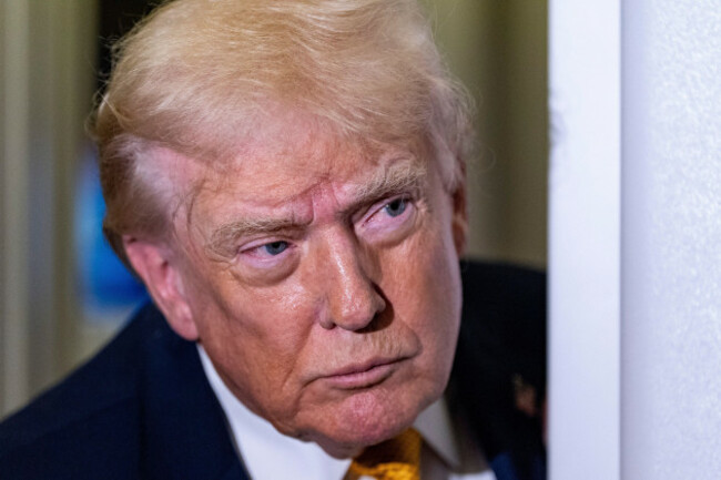 president-donald-trump-speaks-with-reporters-while-in-flight-on-air-force-one-sunday-jan-4-2026-as-they-were-returning-to-joint-base-andrews-md-ap-photoalex-brandon