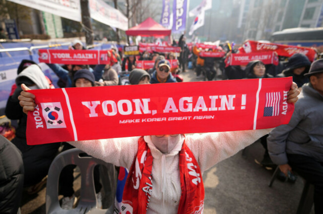 supporters-of-former-south-korean-president-yoon-suk-yeol-hold-signs-outside-seoul-central-district-court-in-seoul-south-korea-friday-jan-16-2026-ap-photolee-jin-man