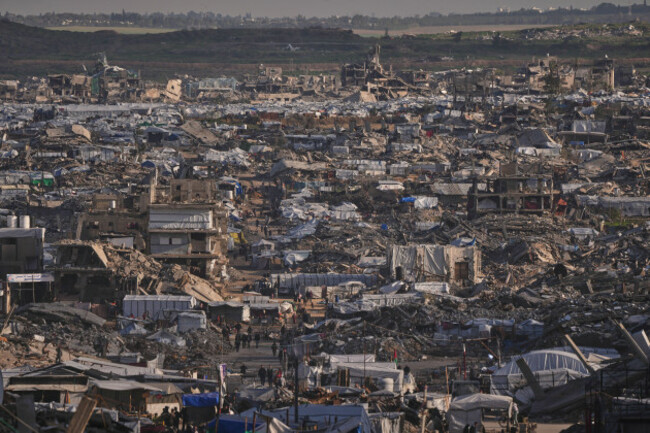 makeshift-tents-shelter-displaced-palestinians-stand-among-buildings-destroyed-by-israeli-air-and-ground-operations-in-gaza-city-thursday-jan-15-2026-ap-photojehad-alshrafi