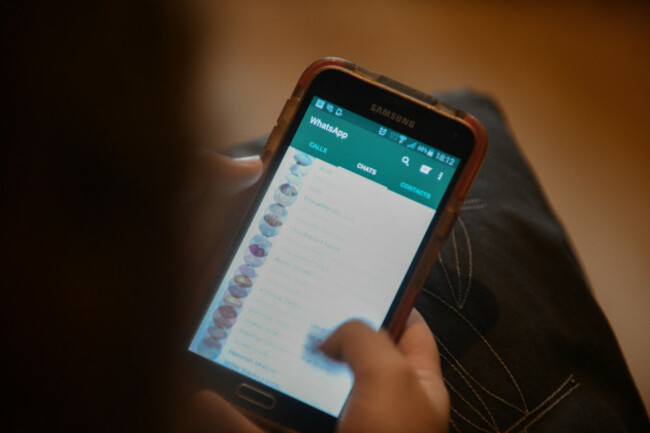 a-person-checks-their-whatsapp-messenger-service-on-their-mobile-phone-before-then-checking-facebook