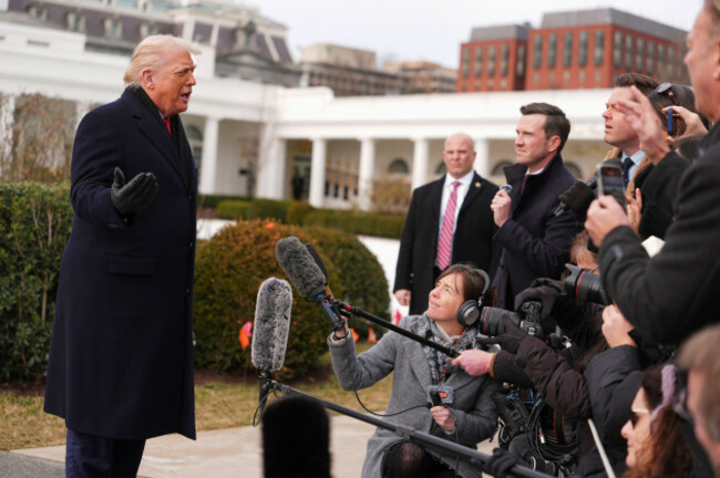 president-donald-trump-takes-questions-from-reporters-before-departing-on-marine-one-from-the-south-lawn-of-the-white-house-friday-jan-16-2026-in-washington-ap-photoevan-vucci