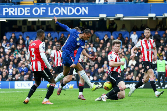 joao-pedro-of-chelsea-shoots-at-goal-blocked-by-nathan-collins-of-brentford-during-the-chelsea-v-brentford-premier-league-match-at-stamford-bridge-london-england-on-17-january-2026-credit-ian-step