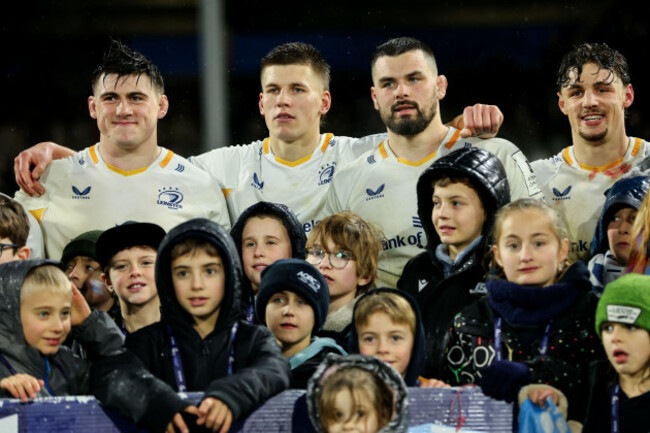 dan-sheehan-sam-prendergast-max-deegan-and-joshua-kenny-pose-with-young-fans-after-the-game