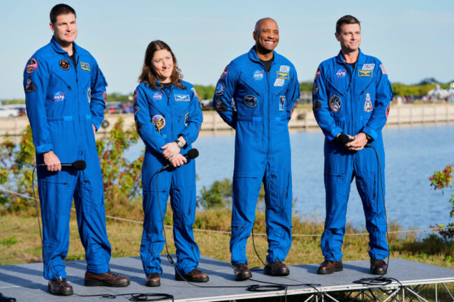 the-crew-of-the-new-nasa-moon-rocket-artemis-ii-take-part-in-a-news-conference-from-left-canadian-space-agency-astronaut-jeremy-hansen-mission-specialist-christina-koch-pilot-victor-glover-and