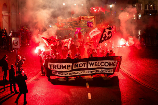 protesters-hold-a-banner-reading-trump-not-welcome-during-a-rally-against-the-world-economic-forum-in-davos-and-the-visit-of-us-president-donald-trump-in-zurich-switzerland-on-monday-jan-19-20