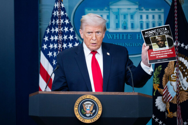 united-states-january-20-president-donald-trump-holds-a-picture-of-what-he-says-is-an-illegal-immigrant-arrested-by-ice-while-speaking-in-the-white-house-briefing-room-about-the-administrations-a