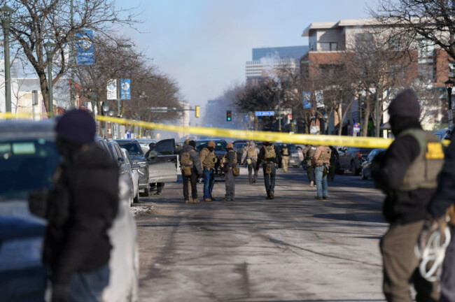 federal-agents-stand-near-the-site-of-a-shooting-saturday-jan-24-2026-in-minneapolis-ap-photoabbie-parr