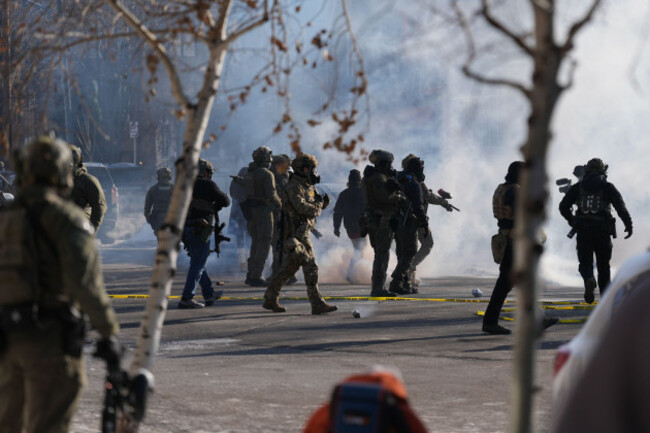 federal-immigration-officers-deploy-tear-gas-at-observers-after-a-shooting-saturday-jan-24-2026-in-minneapolis-ap-photoabbie-parr