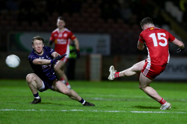 ethan-jordan-scores-a-goal-despite-the-attemptted-block-by-brian-byrne