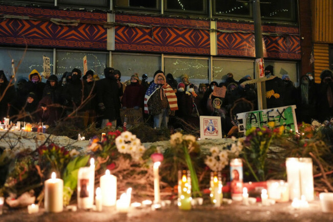 people-gather-during-a-vigil-for-37-year-old-alex-pretti-who-was-fatally-shot-by-a-u-s-border-patrol-officer-earlier-in-the-day-saturday-jan-24-2026-in-minneapolis-ap-photoadam-gray