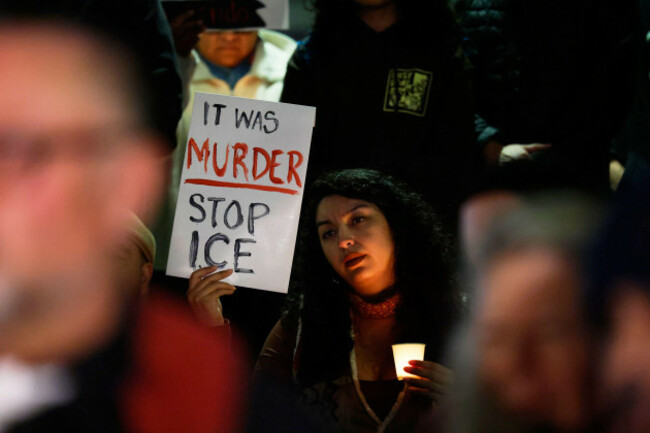 a-demonstrator-holds-a-sign-during-a-candlelight-vigil-during-a-protest-in-response-to-the-fatal-shooting-of-37-year-old-alex-pretti-in-minneapolis-earlier-in-the-day-saturday-jan-24-2026-in-los-a