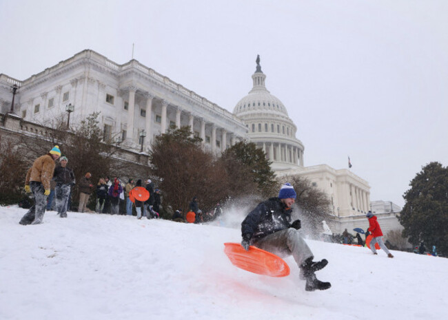 washington-dc-virginia-usa-25th-jan-2026-people-sled-down-the-u-s-capitol-hill-during-a-winter-storm-in-washington-dc-on-january-25-2026-a-massive-winter-storm-drop-a-mix-of-freezing-rain-an